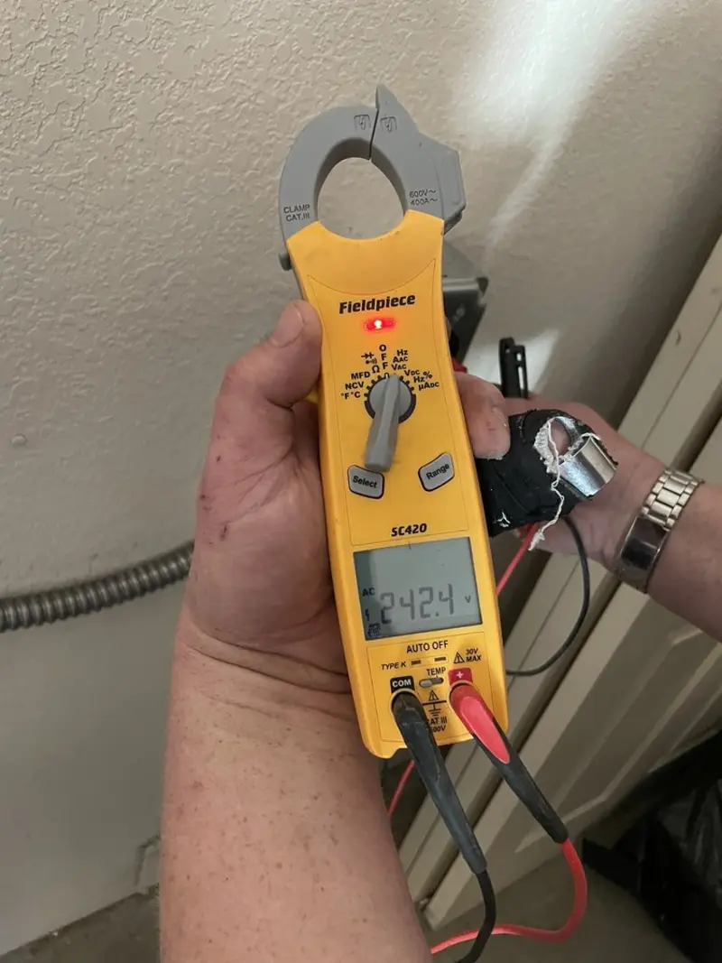 Voltage testing with clamp meter during Whole House Surge Protector in Port Arthur